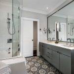 Modern bathroom in Newburyport, MA with patterned tile floor and double sink vanity