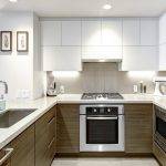 Modern custom kitchen cabinets with integrated handles by Blue Heron in Portsmouth, NH